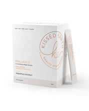 Packaging of Kissed Earth Brilliance hydrolysed collagen supplement in pineapple coconut flavor, featuring a box and single serve sachets.